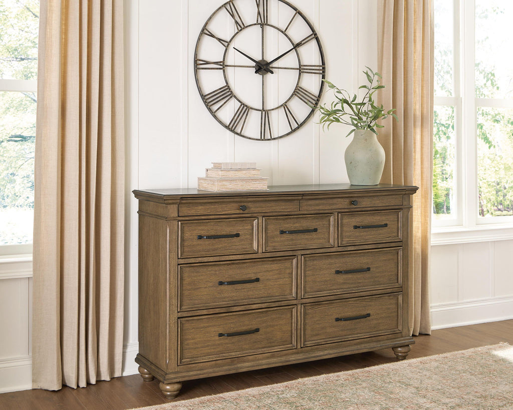 Dark brown dresser with attached mirror and multiple drawers; metal bar pulls on feet.