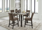 Counter-height dining table with four dark brown bar stools and marble-look top