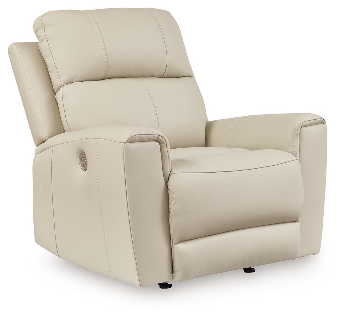 Light beige power rocker recliner with padded headrest and armrests