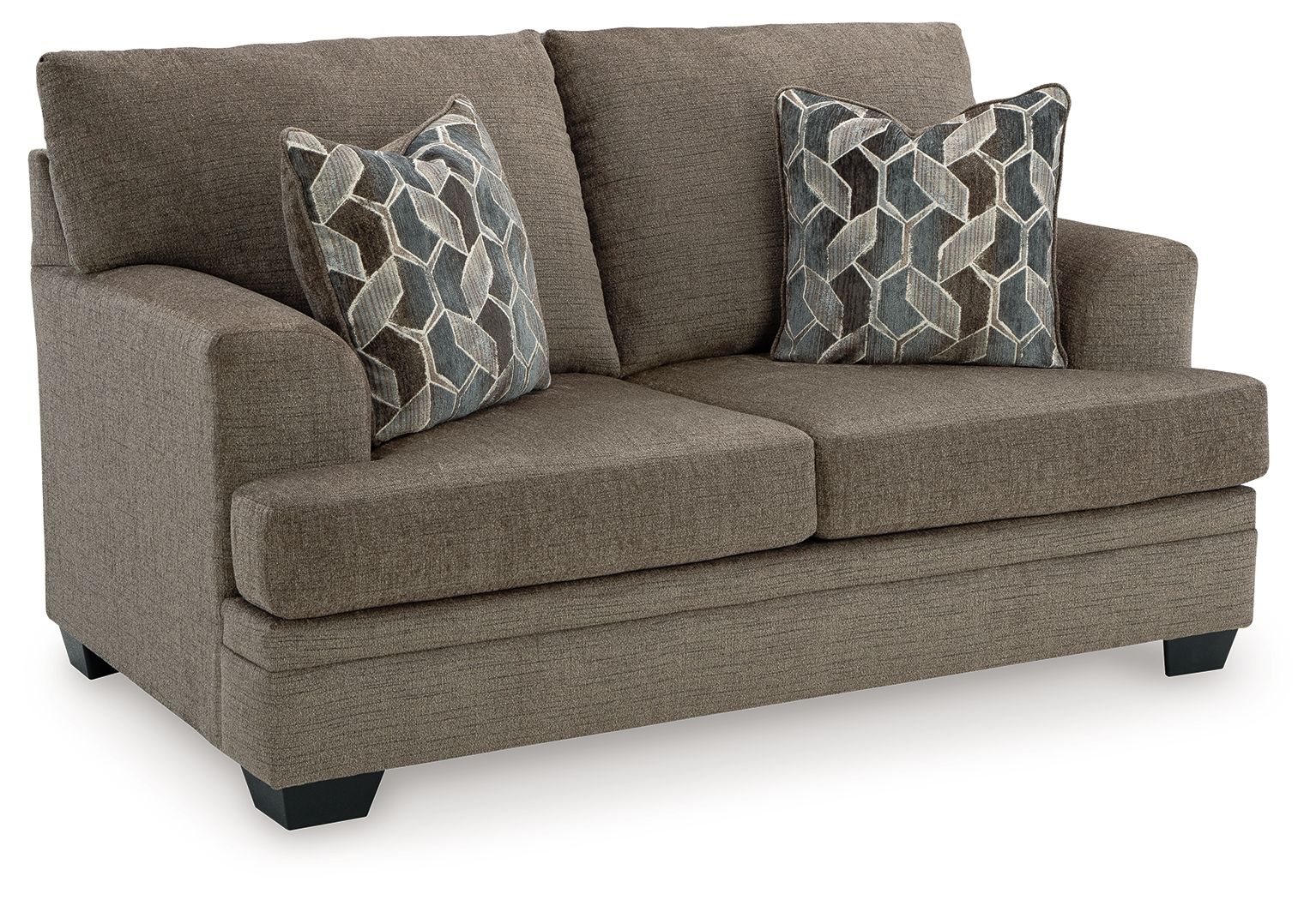 Light beige fabric loveseat with two geometric patterned throw pillows, angled view
