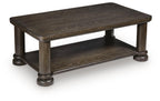 Dark brown rectangular table with lower shelf and chunky turned legs in dark finish