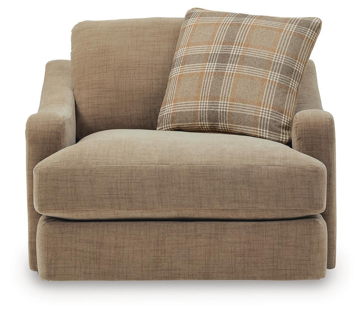 Chair and a half armchair with tan fabric upholstery and plaid accent pillow