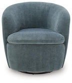 Swivel accent chair in blue-gray velvet with rounded backrest and cushioned seat.