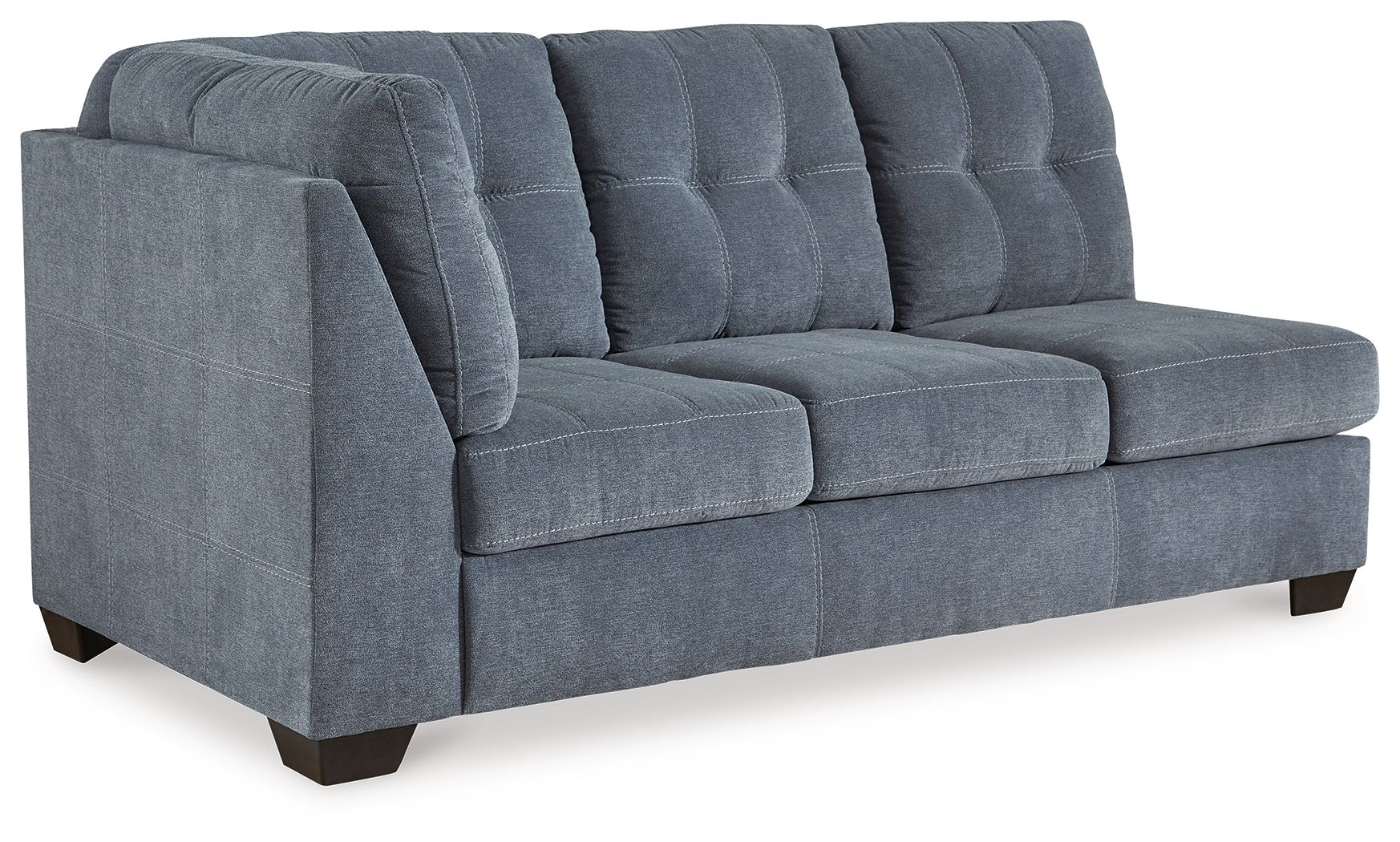 Blue-gray sofa with rounded arms, tufted back cushions, padded seat, and dark legs