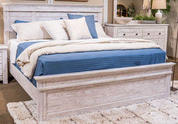Whitewash wood king panel headboard with upholstered bed frame and pillows