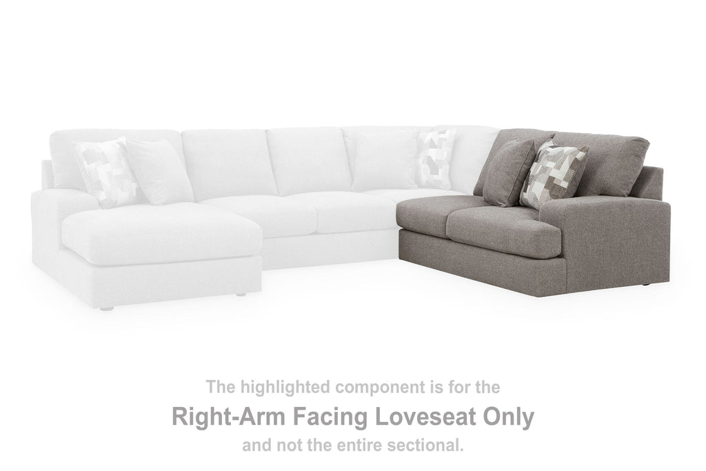 Smoke gray right-arm facing loveseat with white sectional seats and pillows