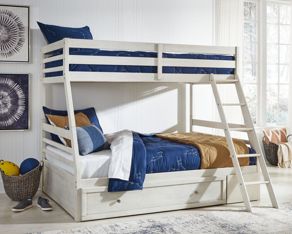 White bunk bed with storage drawer, guard rails, and ladder; styled bedding