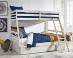White bunk bed with storage drawer, guard rails, and ladder; styled bedding