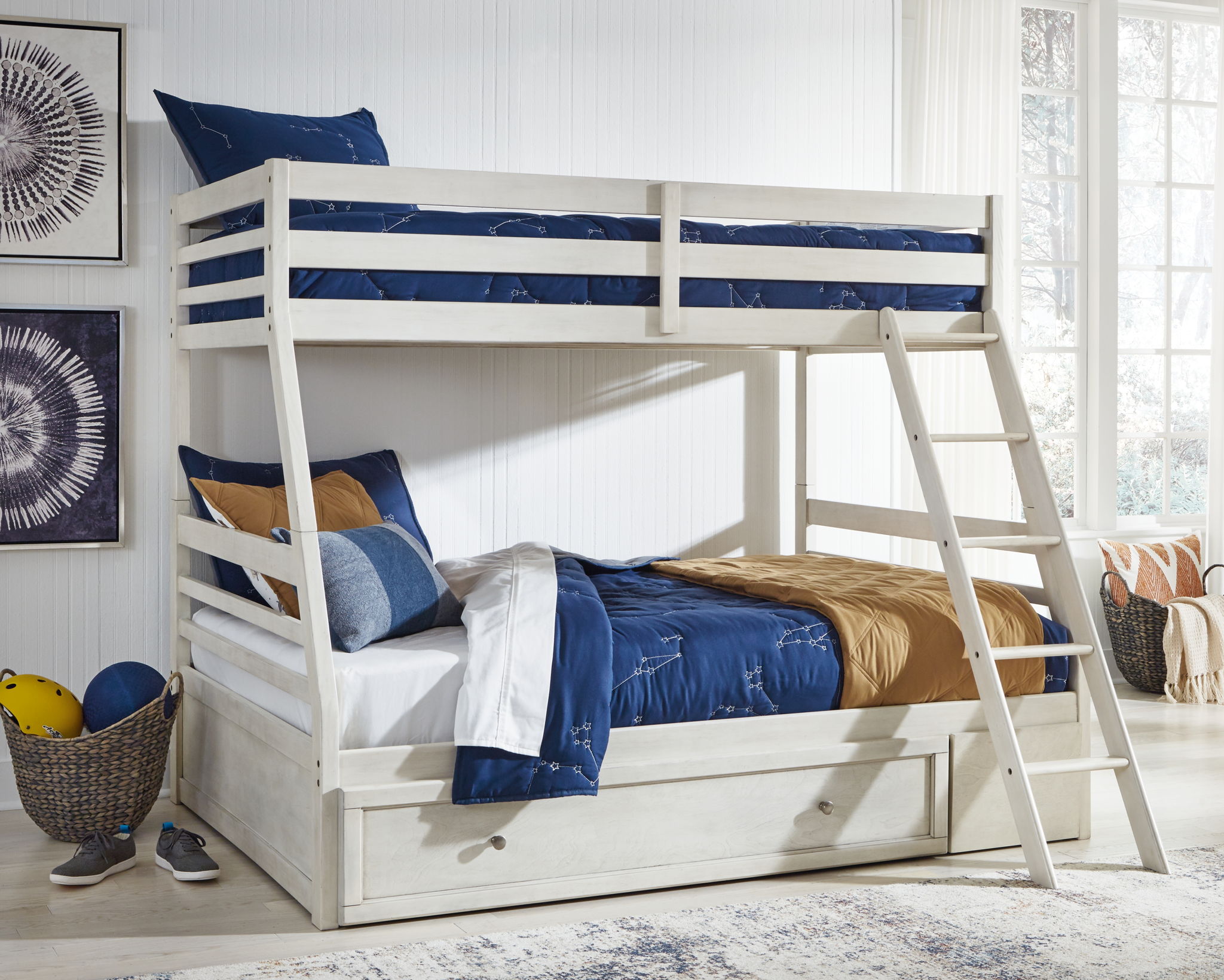 White bunk bed with storage drawer, guard rails, and ladder; styled bedding