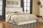 Willowton bedroom set panel headboard bed with striped comforter and pillows