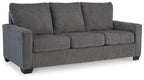 Dark gray 3-seat sofa with padded armrests and segmented cushions