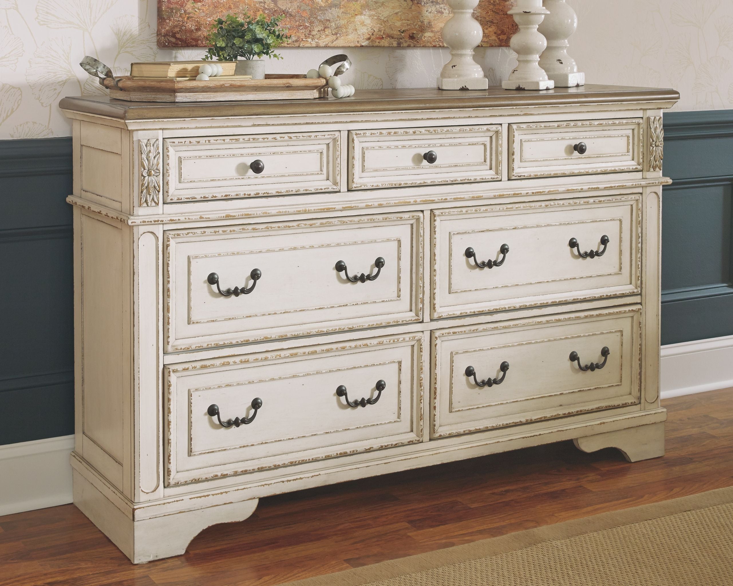 Two-tone dresser with mirror and six drawers, dark metal cup handles.