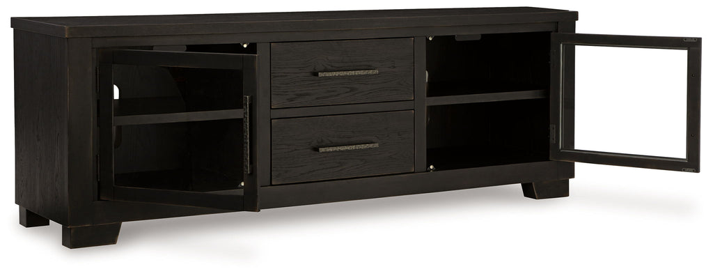 Extra large black TV stand with one side open shelf, two drawers, and one cabinet door