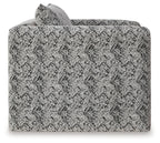 Close-up of black-and-white textured upholstery on accent chair back and seat