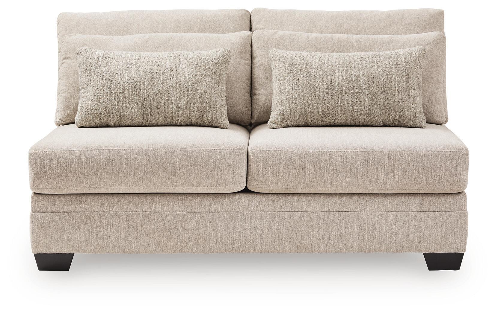 Armless loveseat with light beige upholstery, two back cushions, and dark legs