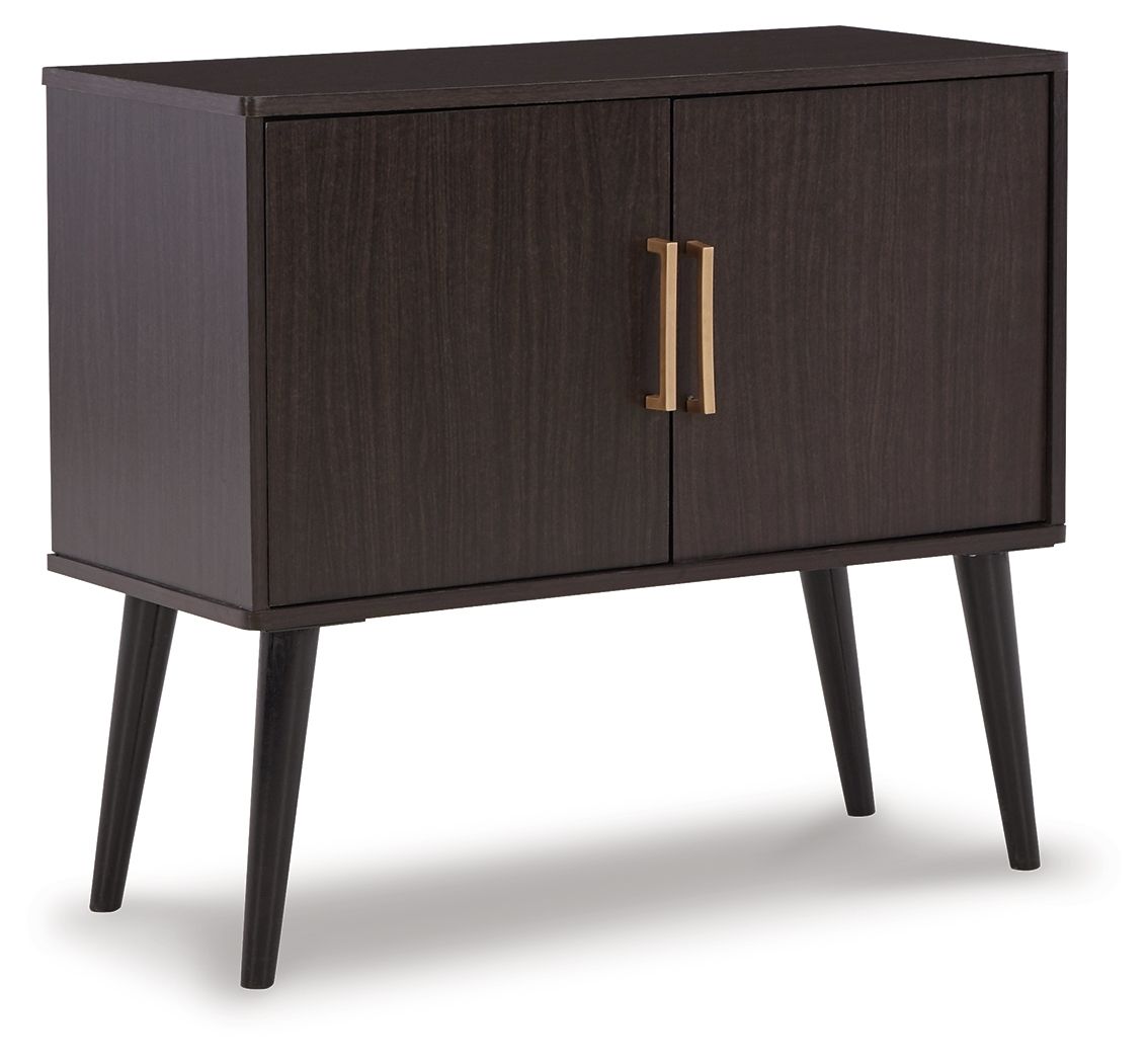 Dark wood accent cabinet with two doors and gold bar pulls, raised on legs