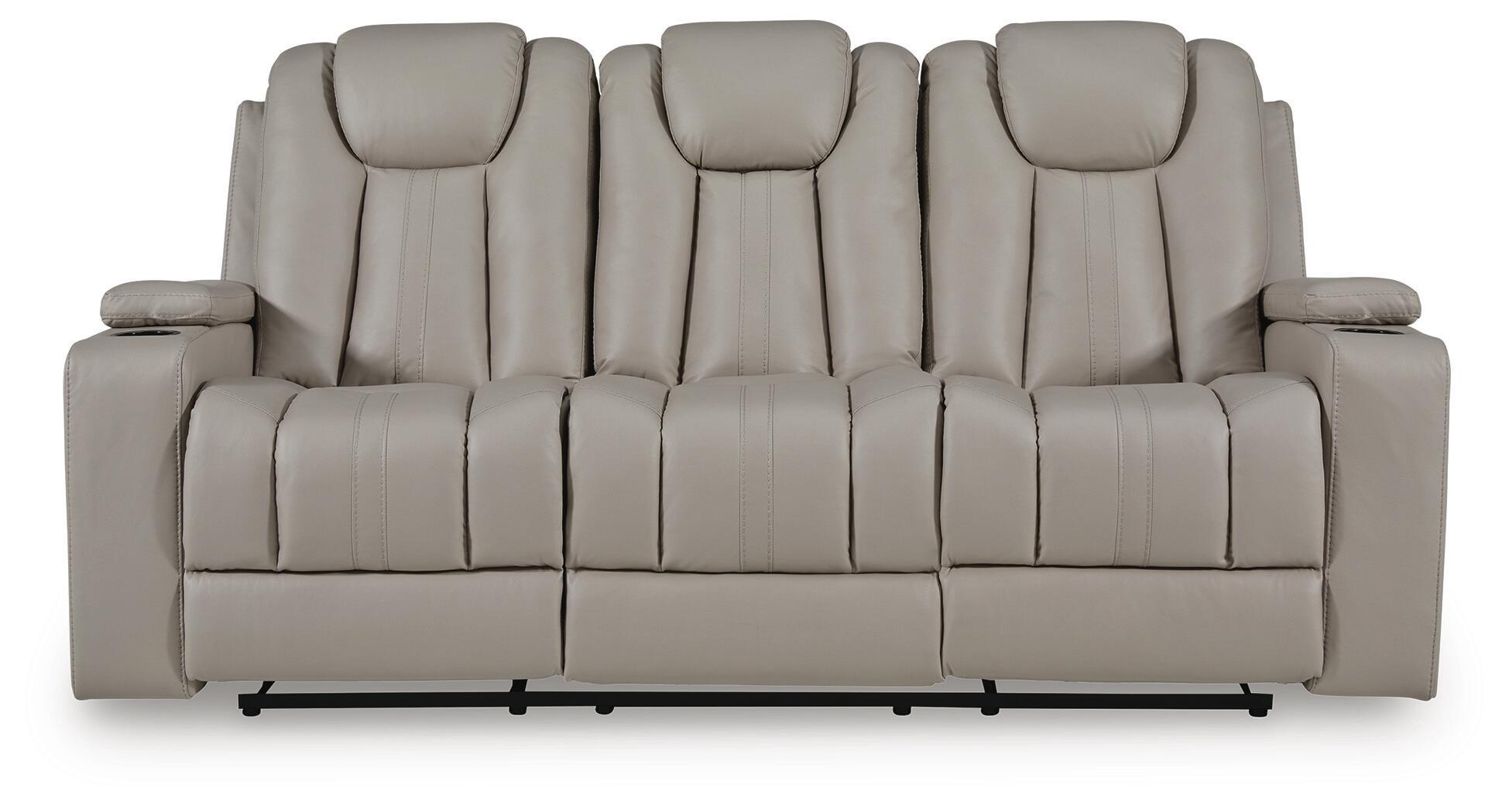 Reclining sofa back view with five padded seat sections and light beige upholstery