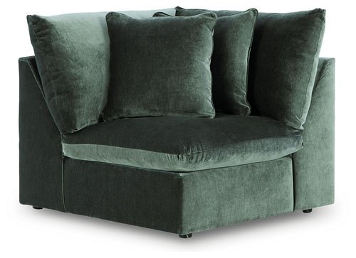 Jade green velvet wedge chair with wide arms and thick back cushions