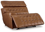 Chocolate brown leather power recliner showing extended footrest and tufted seat back