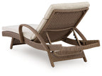 Beige chaise lounge with cushion, woven brown backrest and extended footrest