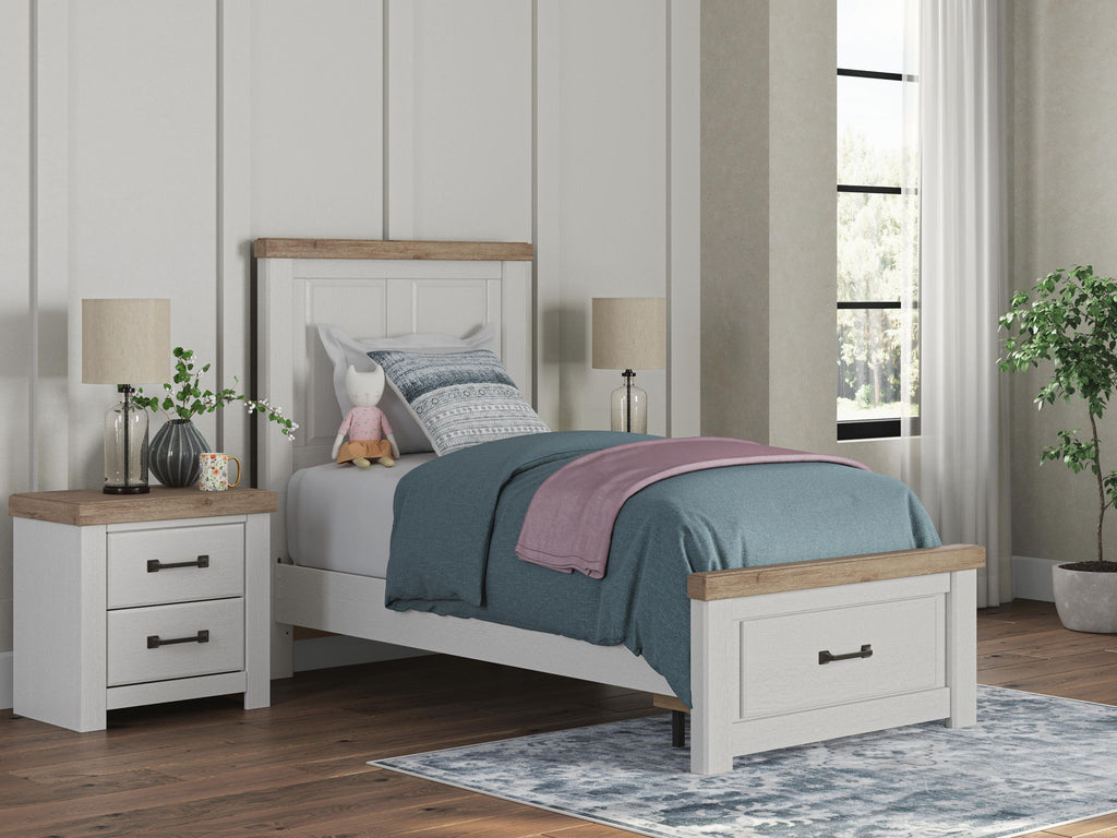 White storage bed with wood-trim headboard and two under-bed drawers, shown in bedroom