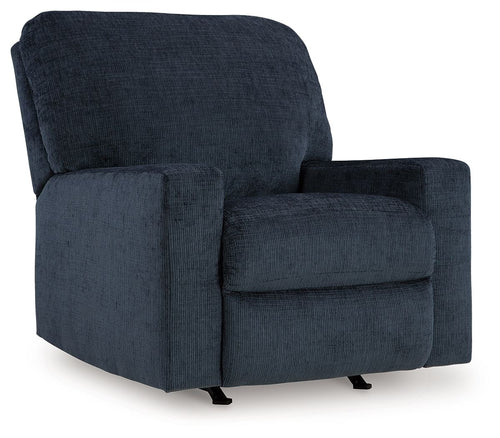 Rocker recliner chair in dark blue upholstered fabric with wide cushioned arms.