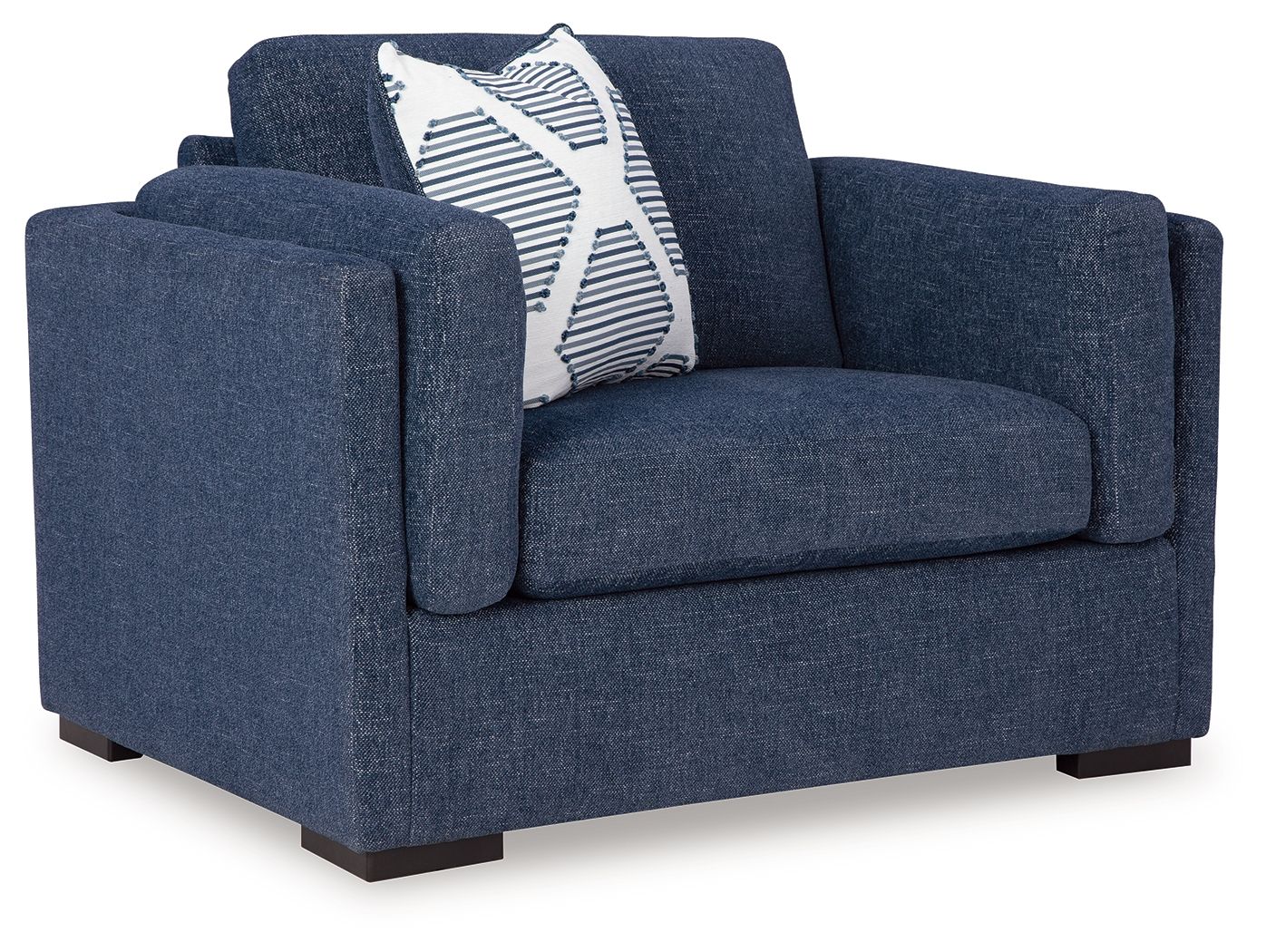 Blue upholstered chair with striped accent pillow and rolled arms