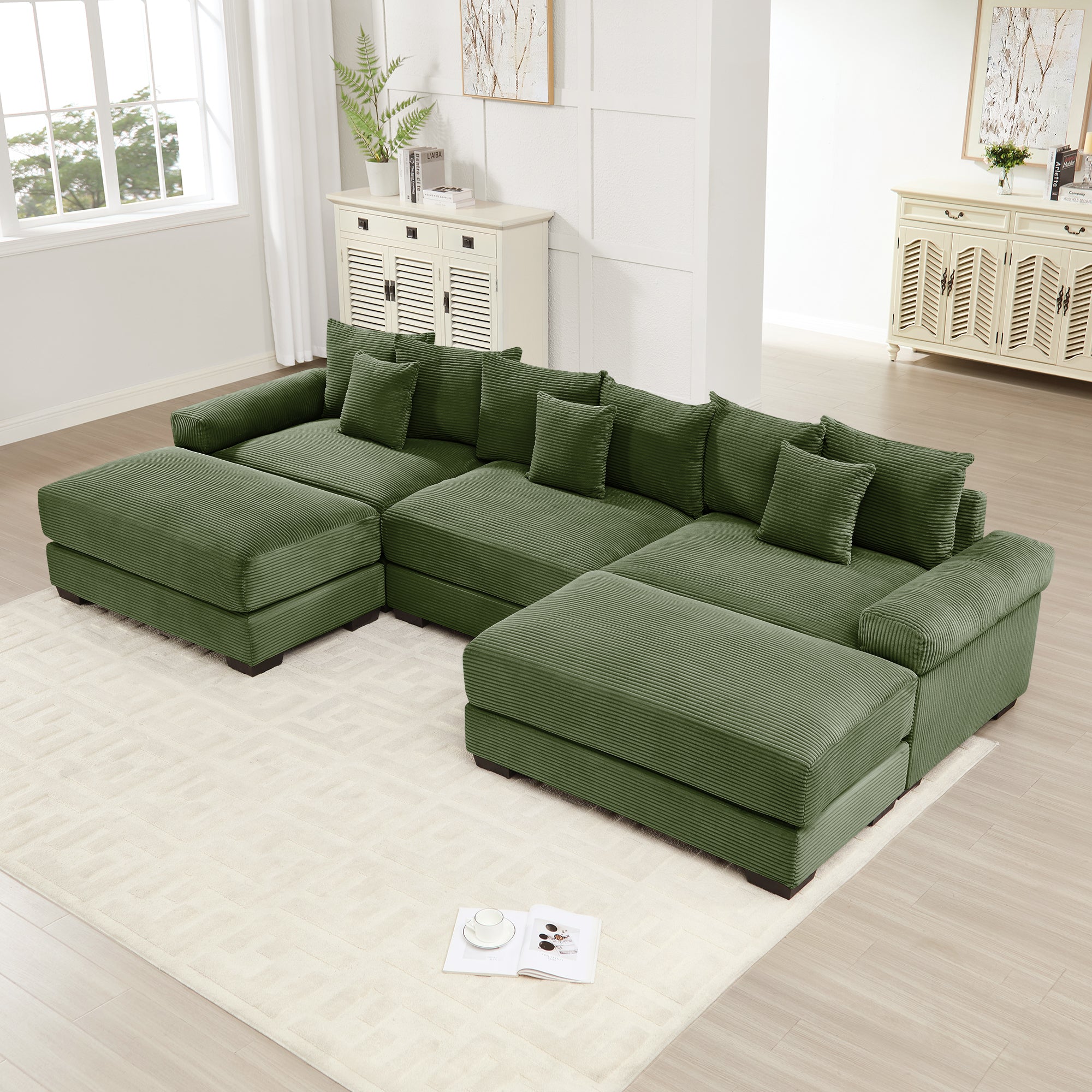 Green modular corduroy sectional sofa with chaise and ottoman sections