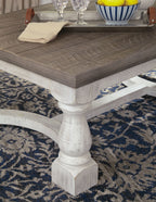 Rectangular cocktail table corner detail, gray surface with white base