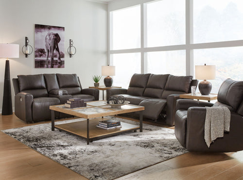 Boxmere dark brown power reclining sofa and loveseat with plush seat cushions