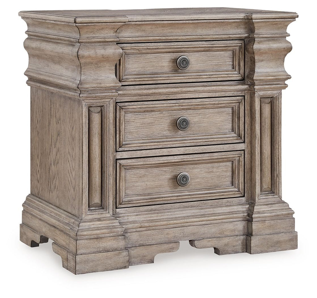 Three-drawer night stand in light grayish brown wood with round knob pulls