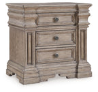Three-drawer night stand in light grayish brown wood with round knob pulls