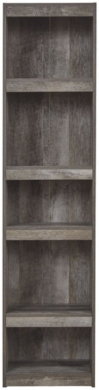 Gray wood open shelving cabinet with several shelf compartments