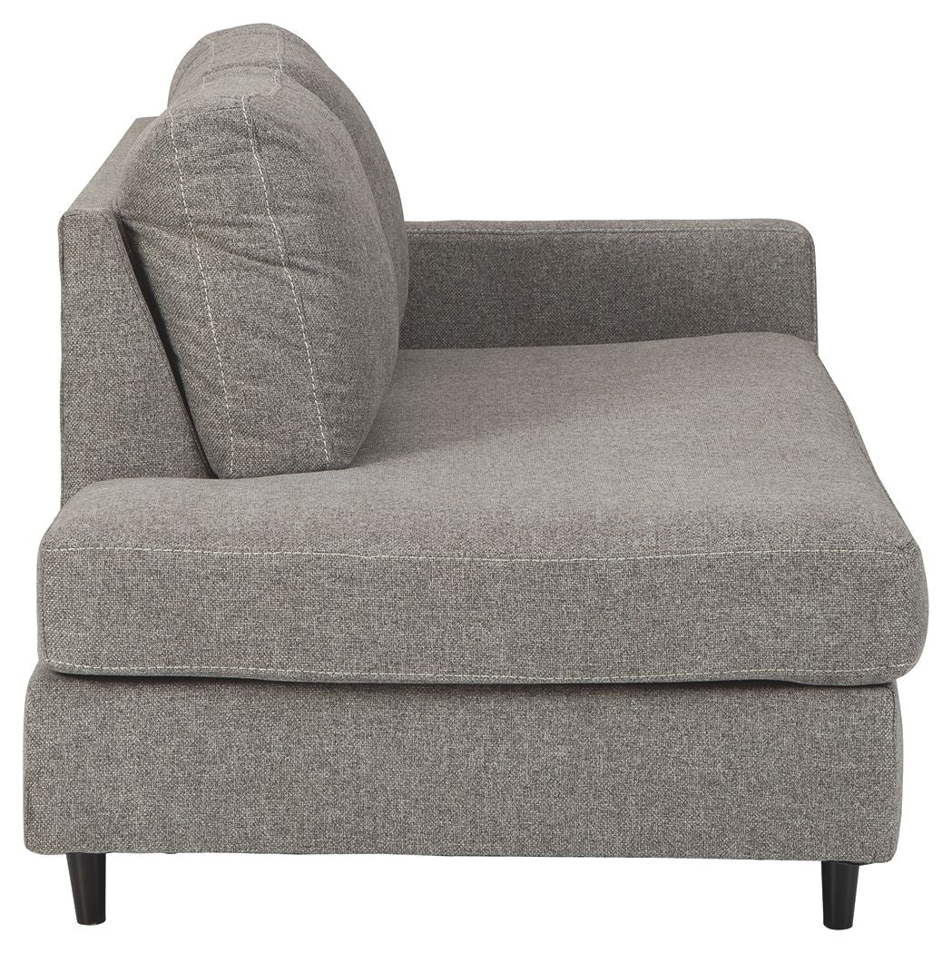 Graphite gray corner chaise sofa with stitched panel pillow and arm detail