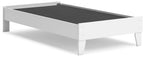 White platform bed frame with open slats and dark interior base