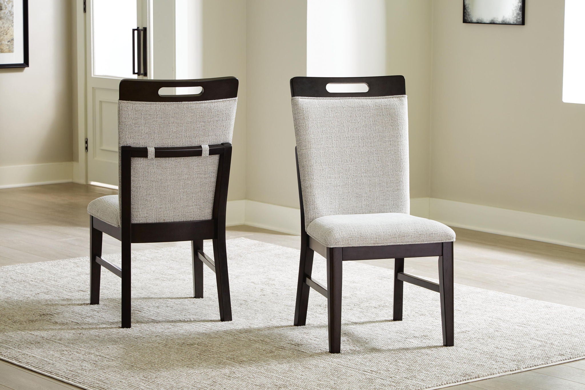 Upholstered dining side chairs with light gray seat and back, dark brown frame