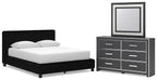 Black upholstered bed with two nightstands and wide dresser with framed mirror