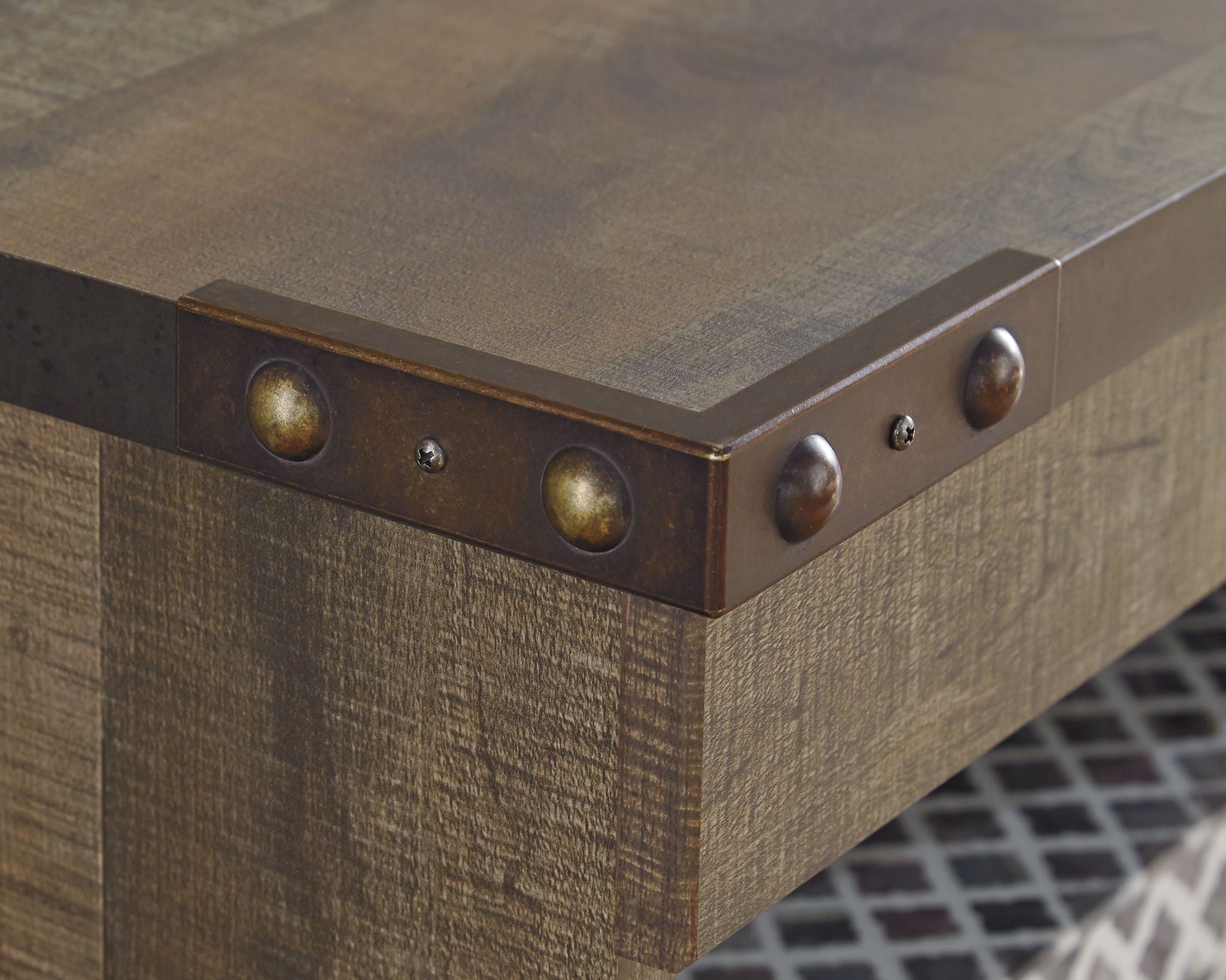 Dark brown entertainment center corner with round metal knobs and inset trim