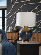 Blue and gold metal table lamp with white fabric shade