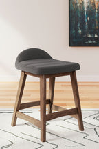 Upholstered barstool with dark gray cushioned seat and back, wooden frame
