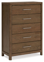 Light brown five-drawer chest with metal bar handles and wooden legs