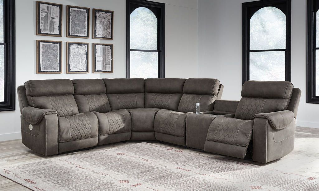 Gunmetal dark gray sectional with armless recliner and adjustable headrest cushion