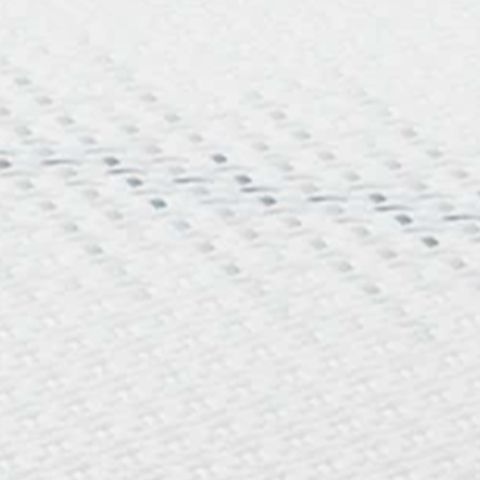 White mattress fabric surface with small quilted pattern