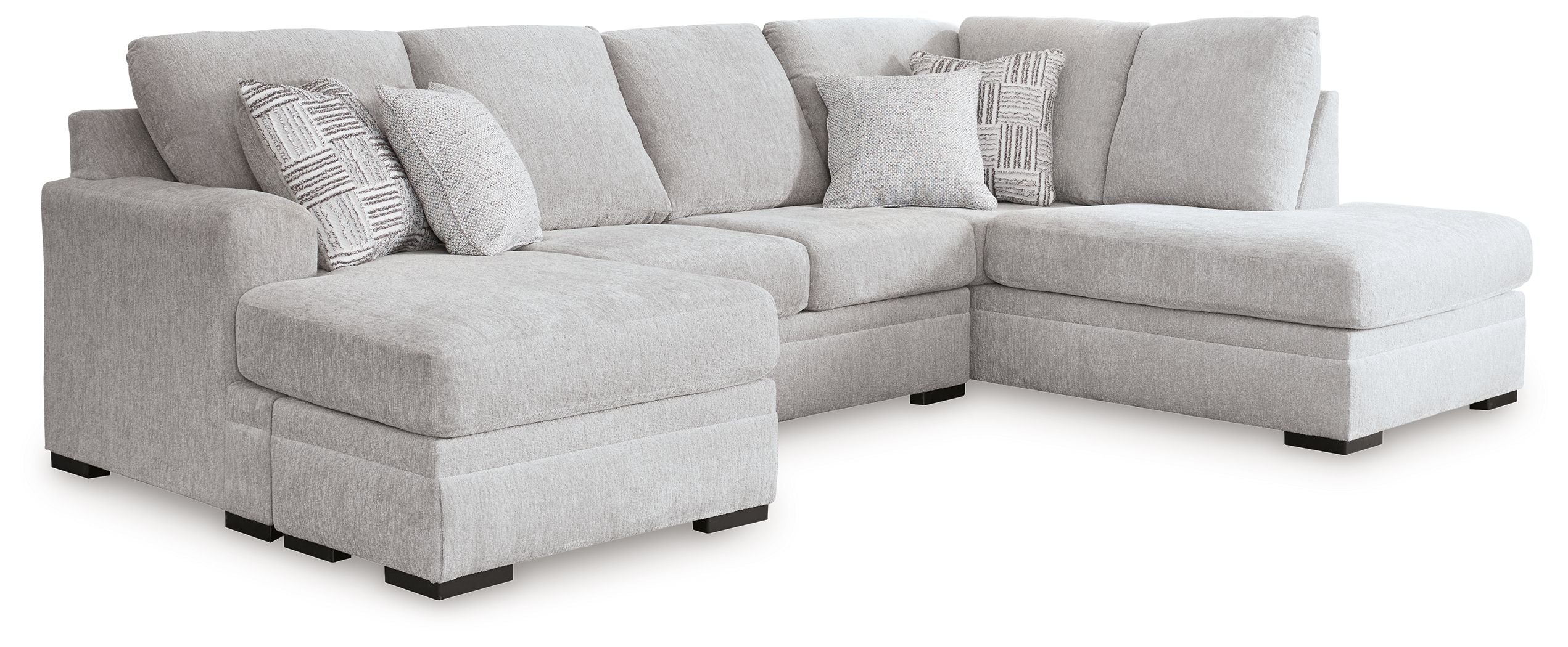 Gray fabric sectional sofa with chaise and tufted cushions, rounded arms and dark legs