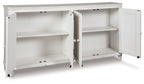 Antique white accent cabinet with two open doors revealing shelves and storage