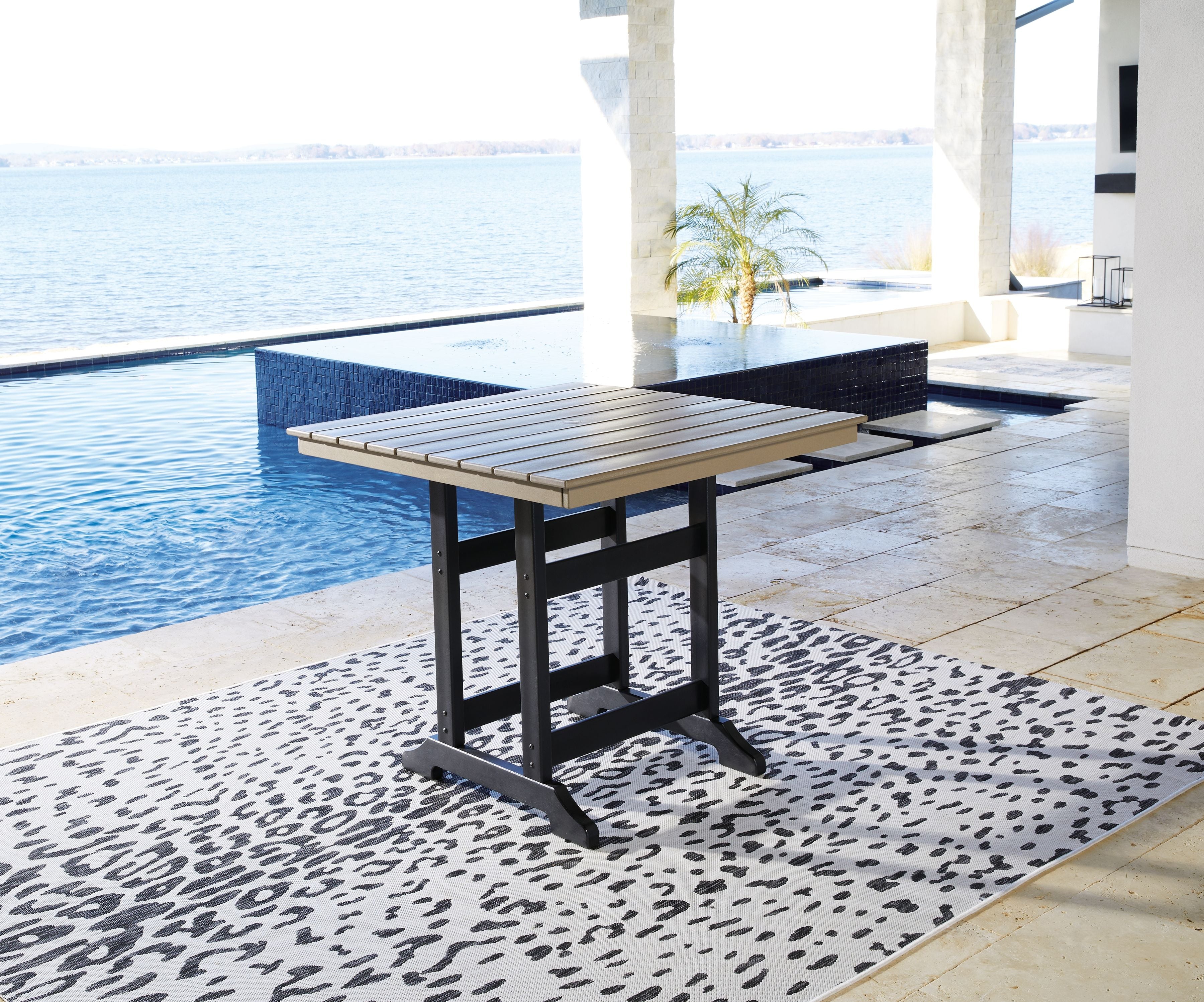 Square outdoor counter table with driftwood top and black base