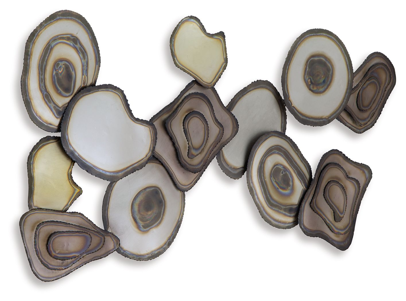Multi-piece wall decor featuring assorted resin discs with concentric rings, white, tan, brown