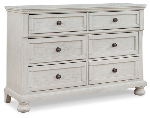 Antique white dresser with six drawers and round knob pulls, paneled sides.