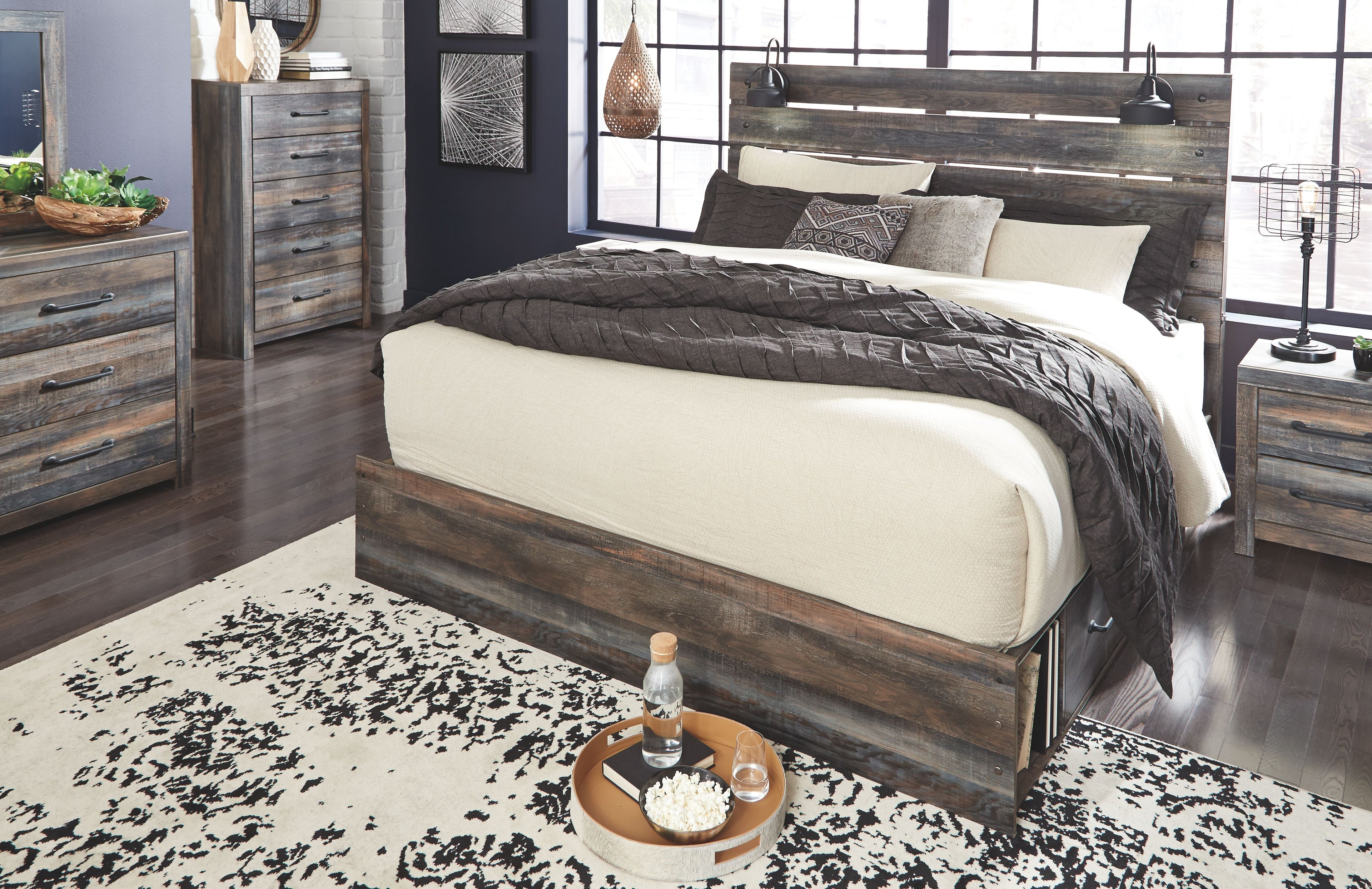 Rustic wood panel bed with white mattress and dark quilt, bed centered in the room