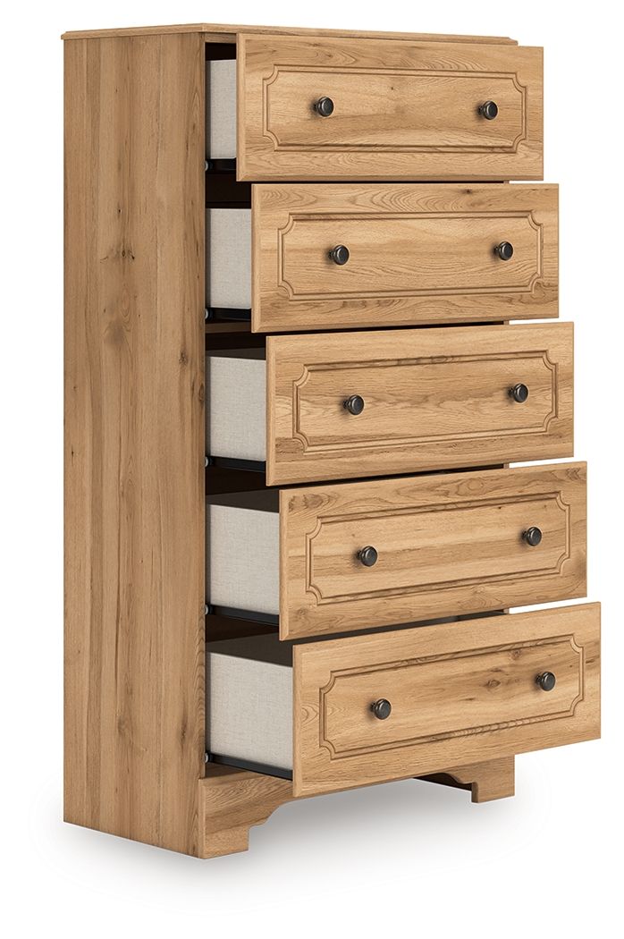 Warm brown five-drawer chest with carved drawer fronts and dark metal knobs
